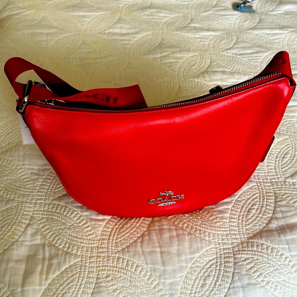 Brand new with tags coach purse. Beautiful smooth leather in a fiery red color.